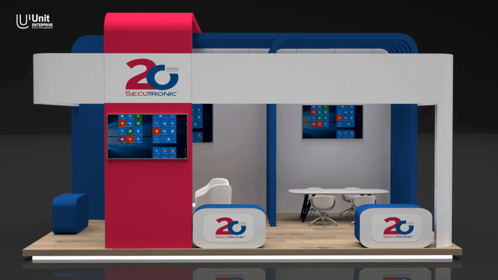 الواجهة الأمامية للجناح مزينة بشعار "20 Years SECUTRONIC" ولوحة شاشة مدمجة.
The front façade of the booth features a "20 Years SECUTRONIC" logo and a built-in screen.